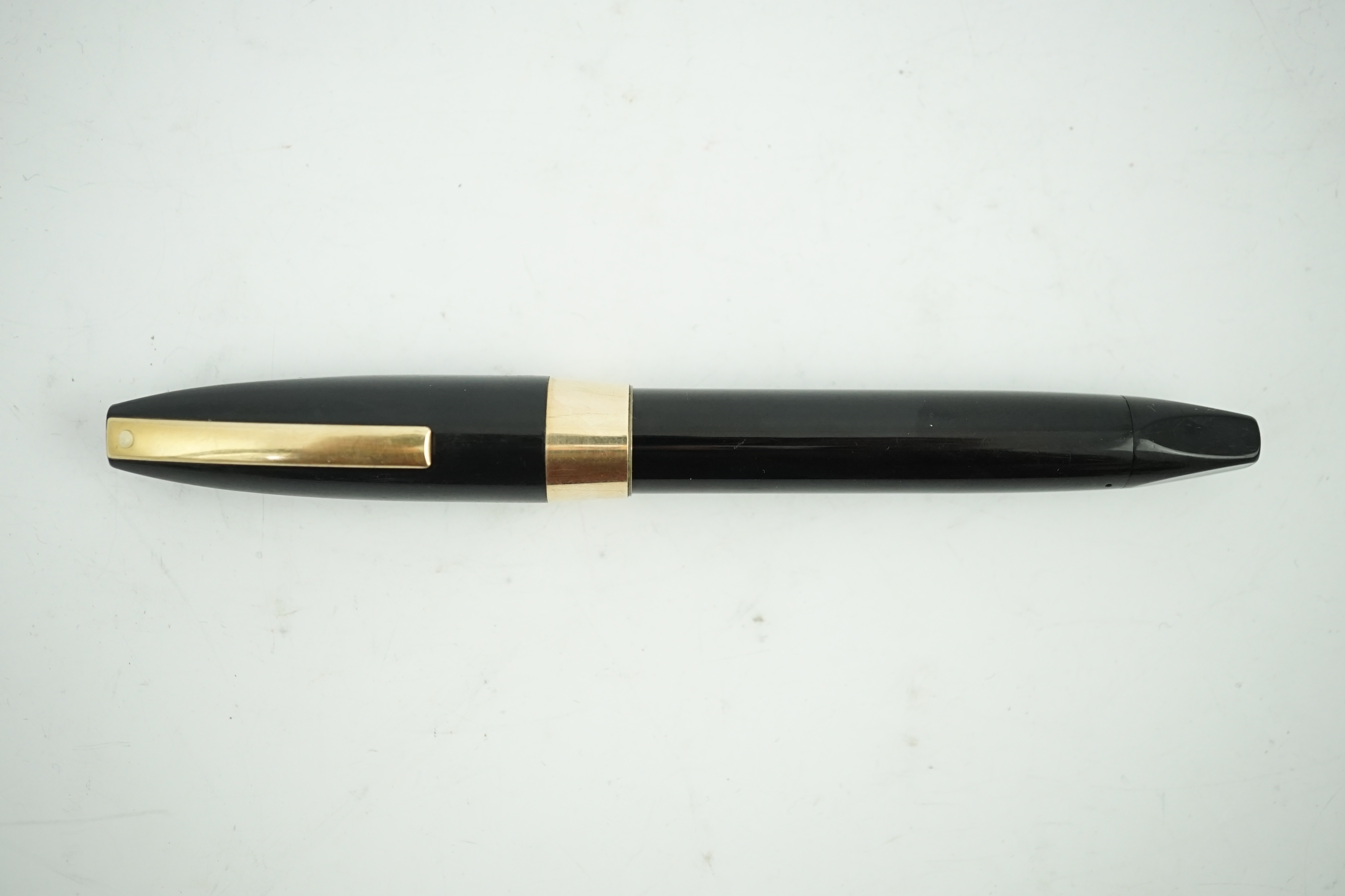 A Sheaffer 'PFM' fountain pen in black gold filled trim